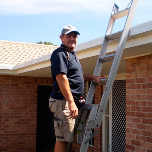 Glenn building pest inspector on ladder