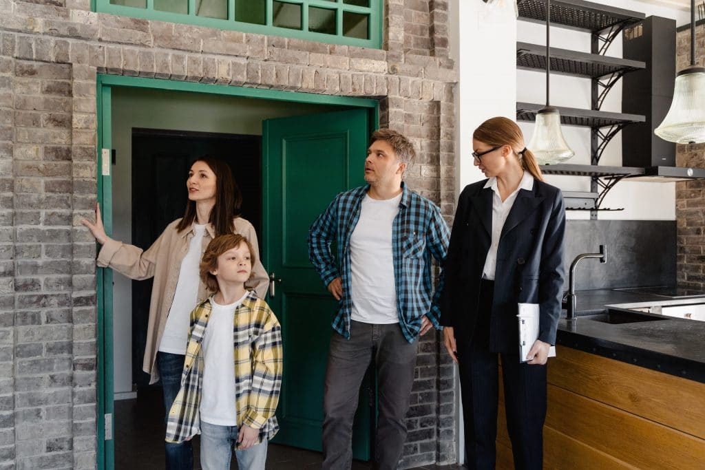 family inspecting a house