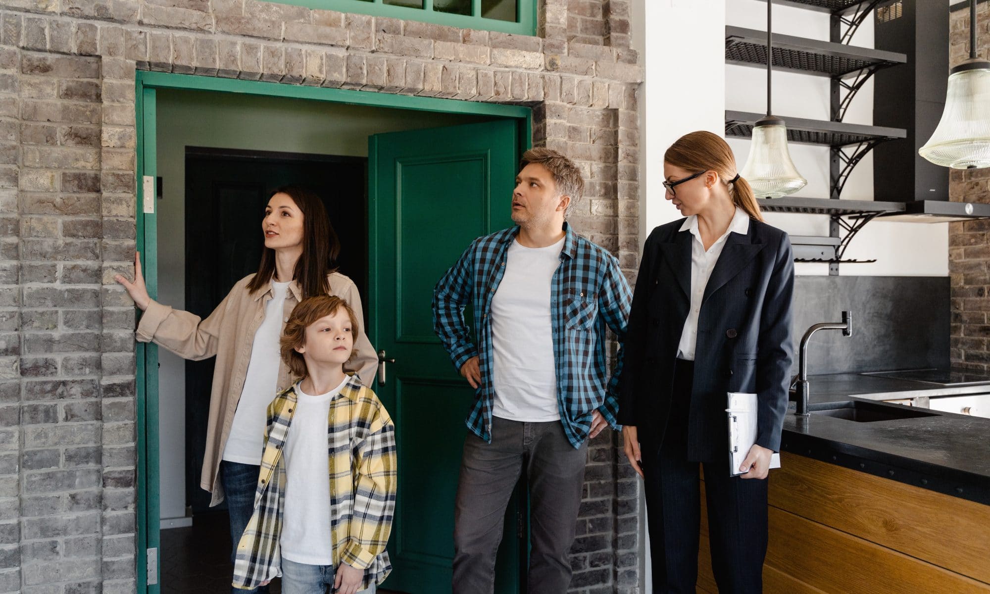 family inspecting a house